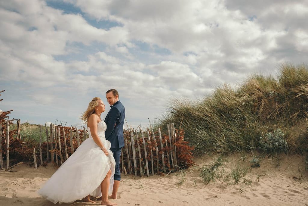 bride and groom portrait on the beach